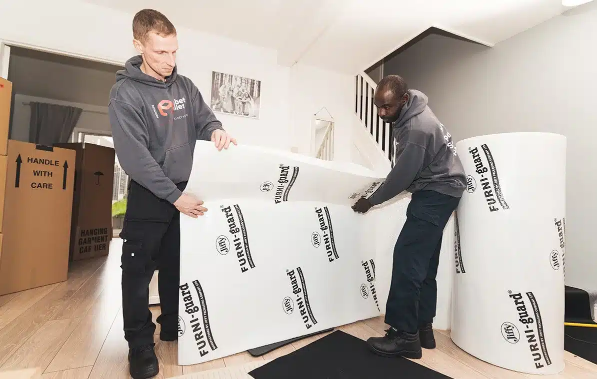 Albert Miles removals team loading household furniture into a moving van
